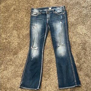 Women's Blue Distressed Jeans. W33/L33